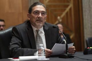 FILE - Then-Census Bureau Director nominee Robert Santos, testifies before the Senate Homeland Security and Governmental Affairs committee, Thursday, July 15, 2021, on Capitol Hill in Washington. Santos, now the Census Bureau director, said Tuesday, Aug. 16, 2022, in an interview with The Associated Press that the statistical agency was starting its outreach efforts with hard-to-reach communities earlier, rather than just before the next count, which is in 2030. (AP Photo/Jacquelyn Martin, File)