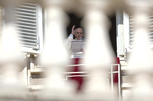 Pope Francis delivers his blessing as he recites the Angelus noon prayer from the window of his studio overlooking St.Peter's Square, at the Vatican, Sunday, Oct. 24, 2021. (AP Photo/Andrew Medichini)
