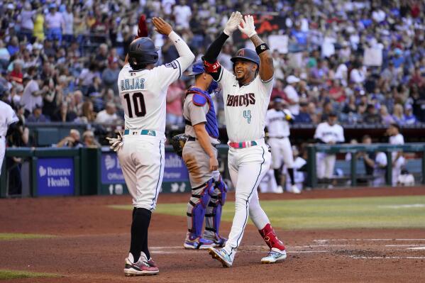 Arizona Diamondbacks' Lourdes Gurriel Jr. (12) celebrates his RBI double  against the Los Angeles Dodgers during the first inning of a baseball game,  Saturday, April 8, 2023, in Phoenix. (AP Photo/Matt York