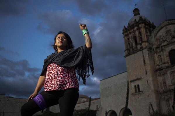Abortion-rights activist Viridiana Bautista of the organization Las Consejeras, poses for a portrait in Oaxaca, Mexico, Wednesday, Oct. 12, 2022. Bautista, 36, had an abortion almost 13 years ago that led to serious medical complications. Due to her religious upbringing, Bautista said she initially felt guilty about her decision, but overcame that as she became engaged in abortion-rights activism. (AP Photo/Maria Alferez)
