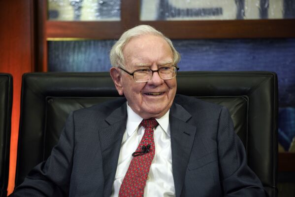 FILE - Berkshire Hathaway Chairman and CEO Warren Buffett smiles during an interview, May 7, 2018, in Omaha, Neb. Investors soon won't be able to follow Buffett's every move in HP Inc.'s stock if the billionaire's company keeps selling off shares of the printer and computer maker. That's because Berkshire Hathaway is about to drop below 10% ownership of HP after the latest sales of nearly 5 million shares that Buffett's company disclosed late Monday, Oct. 2, 2023. (AP Photo/Nati Harnik, File)