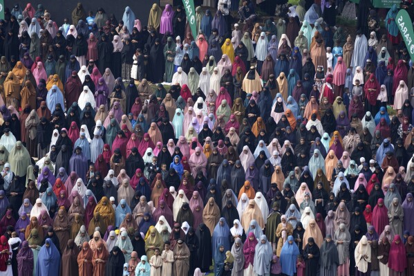 Muslim women devotees offer Eid al-Fitr prayers to mark the end of Ramadan, the Islamic holy month of fasting, in Nairobi, Kenya Wednesday, April. 10, 2024. (AP Photo/Brian Inganga)