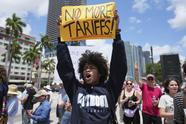 Paul Ivanov chants slogans during a protest against the Trump administration, Saturday, April 19, 2025, in Miami. (AP Photo/Lynne Sladky)