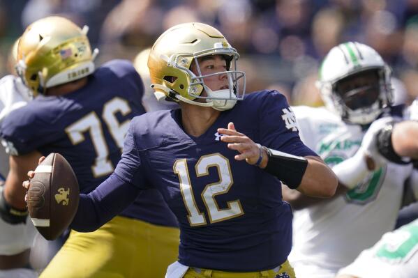 FILE - Notre Dame quarterback Tyler Buchner (12) throws against Marshall during the first half of an NCAA college football game in South Bend, Ind., Saturday, Sept. 10, 2022. No. 19 Notre Dame faces 20th-ranked South Carolina in the Gator Bowl. (AP Photo/Michael Conroy, File)