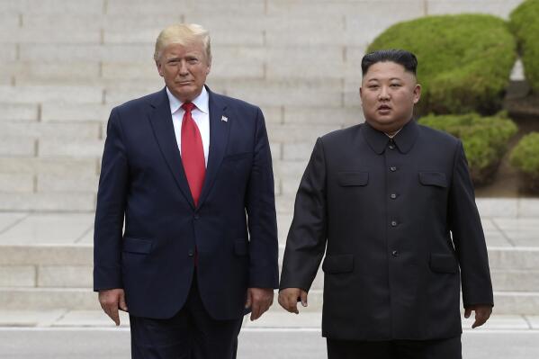 FILE - Then U.S. President Donald Trump, left, meets with North Korean leader Kim Jong Un at the North Korean side of the border at the village of Panmunjom in Demilitarized Zone, on June 30, 2019. Former U.S. President Trump has criticized the Biden administration over its handling of North Korea, at an event in South Korea that included as a guest speaker former Vice-President Mike Pence.(AP Photo/Susan Walsh, File)