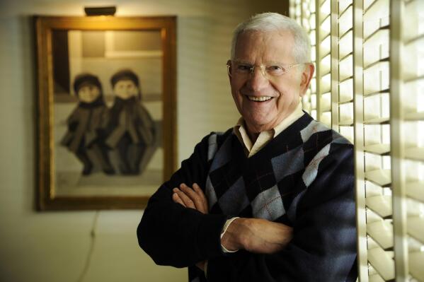 FILE - Actor, artist and singer Robert Clary poses for a portrait in his home studio on Feb. 26, 2014, in Beverly Hills, Calif.  Clary, who played a prisoner of war in the TV sitcom “Hogan’s Heroes,” died  Wednesday of natural causes at his home in Beverly Hills, Calif. He was 96.  (Photo by Chris Pizzello/Invision/AP, File)