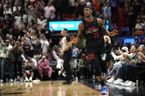 Miami Heat forward Jimmy Butler (22) reacts after scoring against the Detroit Pistons during the second half of an NBA basketball game Tuesday, March 5, 2024, in Miami. (AP Photo/Lynne Sladky)