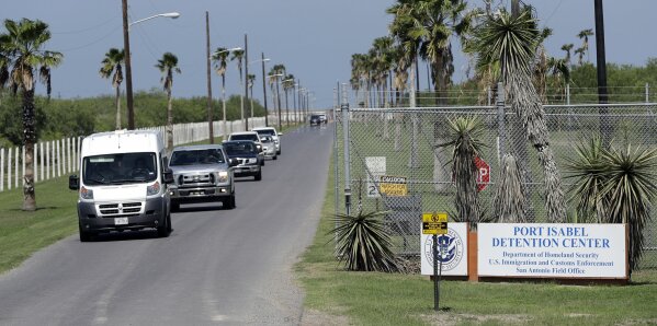 
              FILE - In this June 26, 2018, file photo, vehicles leave the Port Isabel Detention Center, which holds detainees of the U.S. Immigration and Customs Enforcement in Los Fresnos, Texas. Immigration officials say a 24-year-old woman delivered a stillborn baby while in custody last week. They say the Honduran woman was about six months pregnant when she went into premature labor and delivered a stillborn boy on Friday, Feb.22, 2019 after having been hospitalized but cleared for release a day earlier. She had spent four days in immigration custody. In a joint statement, U.S. Customs and Border Protection and Immigration and Customs Enforcement, two separate agencies that fall under the homeland security department, said the woman was arrested by the Border Patrol on Feb. 18 near Hidalgo, Texas. (AP Photo/David J. Phillip, file)
            
