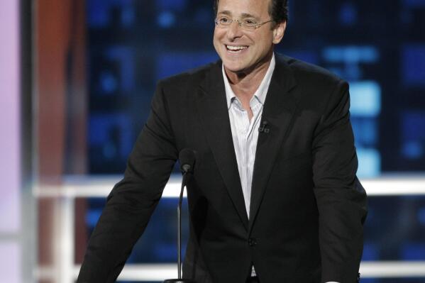 FILE - In this Aug. 3, 2008, file photo, actor and roastee Bob Saget speaks at the "Comedy Central Roast of Bob Saget," in Burbank, Calif. Saget, a comedian and actor known for his role as a widower raising a trio of daughters in the sitcom “Full House,” has died, according to authorities in Florida, Sunday, Jan. 9, 2022. He was 65. (AP Photo/Dan Steinberg, File)