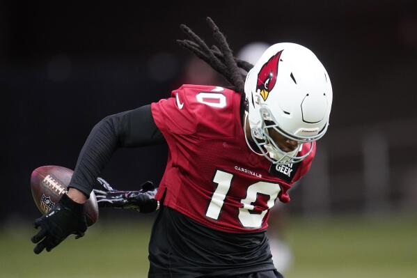 Arizona Cardinals wide receiver DeAndre Hopkins makes a catch as he takes part in drills at the NFL football team's training camp Wednesday, July 27, 2022, in Glendale, Ariz. (AP Photo/Ross D. Franklin)