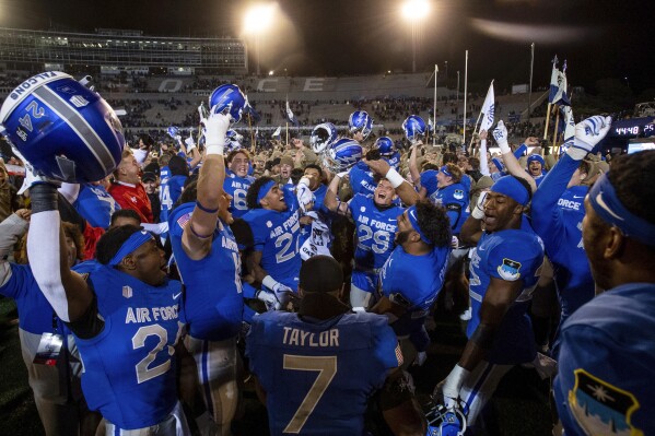 Air Force celebrates a win over Wyoming in an NCAA college football game Saturday, Oct. 14, 2023, at Air Force Academy, Colo. (Parker Seibold/The Gazette via AP)