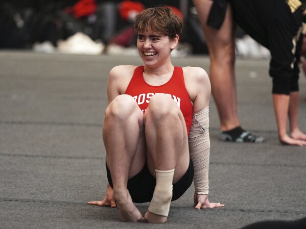 Ten Harder of Boston University Gymnastics Club in Boston, warms up before to competing on the balance beam at the 2025 NAIGC national competition in Pittsburgh, Friday, April 4, 2025. (AP Photo/Gene J. Puskar)