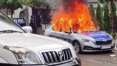 FILE - In this image made from video, Kosovar police car burns in Zvecan, northern Kosovo on May 26, 2023. The European Union has summoned the leaders of Serbia and Kosovo for emergency talks on Thursday June 22, 2023 to try to bring an end to a series of violent clashes near their border that is fueling fears of a return to open conflict. (AP Photo, File)