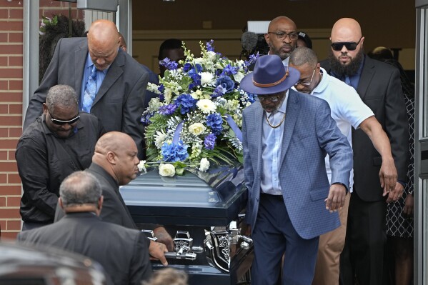 Pallbearers carry the casket of Frank Tyson out of Hear The Word Ministries church following funeral services Wednesday, May 8, 2024, in Canton, Ohio. Tyson, a 53-year-old Black man, died April 18 after he was handcuffed and left facedown on the floor of a social club while telling officers he couldn't breathe. (AP Photo)