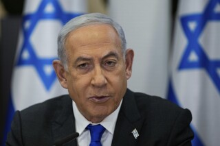 FILE - Israeli Prime Minister Benjamin Netanyahu chairs a cabinet meeting at the Kirya military base, which houses the Israeli Ministry of Defence, in Tel Aviv, Israel, Sunday, Dec . 24, 2023. Israel’s Supreme Court on Monday, Jan. 1, 2024, struck down a key component of Netanyahu’s contentious judicial overhaul, a decision that threatens to reopen the fissures in Israeli society that preceded the country’s ongoing war against Hamas.(AP Photo/Ohad Zwigenberg, Pool, File)