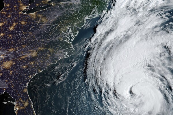 This Thursday, Sept. 14, 2023, 7:51 a.m. EDT satellite image provided by the National Oceanic and Atmospheric Administration shows Hurricane Lee in the Atlantic Ocean. Lee looks poised to wallop New England later this week even as the region still deals with the impact of days of wild weather that produced torrential rain, flooding, sinkholes and a likely tornado. (NOAA via AP)