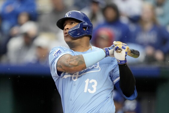 Kansas City Royals' Salvador Perez watches hit two-run home run during the first inning of a baseball game against the Toronto Blue Jays Thursday, April 25, 2024, in Kansas City, Mo. (AP Photo/Charlie Riedel)
