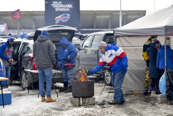 Buffalo Bills fans tailgate outside Highmark Stadium before of an NFL football game between the Buffalo Bills and the Pittsburgh Steelers, Monday, Jan. 15, 2024, in Buffalo, N.Y. (AP Photo/Adrian Kraus)