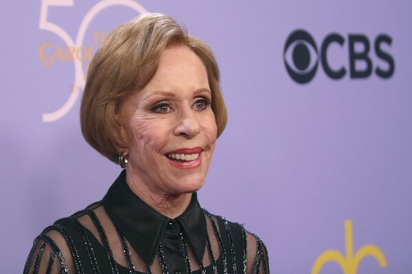 FILE - In this Wednesday, Oct. 4, 2017, file photo, Carol Burnett arrives at the "The Carol Burnett 50th Anniversary Special" at the CBS Television City in Los Angeles. For at least one night, Burnett was a writer among writers: The beloved entertainer was among three panelists Thursday, Oct. 24, 2019, for “An Evening of Memoir,” presented in Manhattan by the MacDowell artist colony. (Photo by Willy Sanjuan/Invision/AP, File)