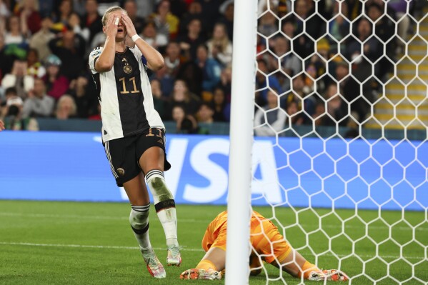 Germany's Alexandra Popp reacts after South Korea's goalkeeper Kim Jung-mi, right, saved her short at goal during the Women's World Cup Group H soccer match between South Korea and Germany in Brisbane, Australia, Thursday, Aug. 3, 2023. (AP Photo/Tertius Pickard)