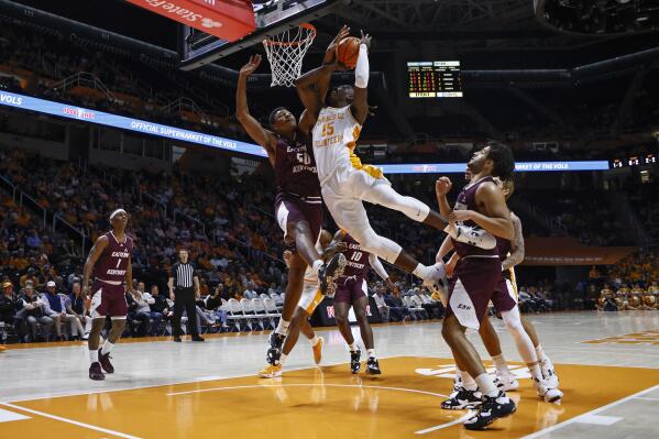 Tennessee guard Jahmai Mashack (15) goes for a shot as he's fouled by Eastern Kentucky forward Isaiah Cozart (50) during the first half of an NCAA college basketball game Wednesday, Dec. 7, 2022, in Knoxville, Tenn. (AP Photo/Wade Payne)