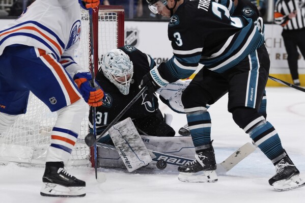 The Oilers beat the Sharks 3-2 despite losing Leon Draisaitl to an  undisclosed injury | AP News