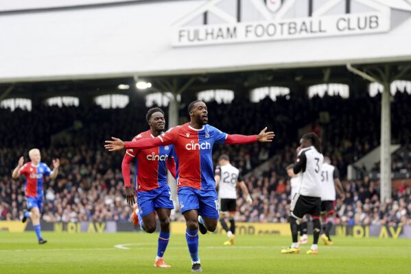 Crystal Palace's Jeffrey Schlupp celebrates after scoring his sides first goal during the English Premier League soccer match between Fulham and Crystal Palace at Craven Cottage, London, Saturday, April 27, 2024. (Zac Goodwin/PA via AP)