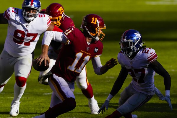 Washington Football Team quarterback Alex Smith (11) wears a