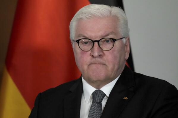 FILE - German President Frank-Walter Steinmeier addresses the media during a statement at Bellevue Palace in Berlin, Germany, Friday, Feb. 25, 2022. A speaker of the Presidential office announced today, that he German President and his wife Elke Buedenbender got infected with the coronavirus.  (AP Photo/Michael Sohn, File)