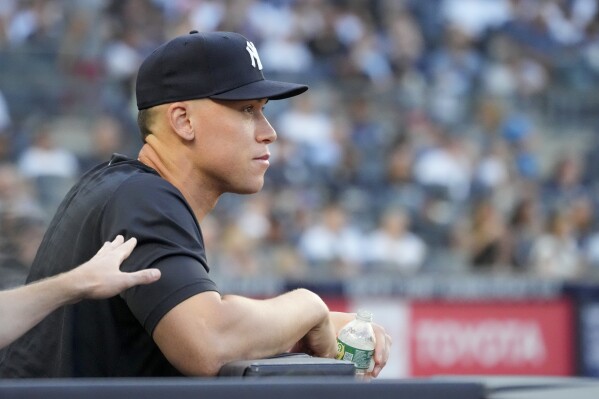 New York Yankees' Aaron Judge watches a baseball game from the dugout in the second inning of a baseball game against the Kansas City Royals, Friday, July 21, 2023, in New York. (AP Photo/Mary Altaffer)