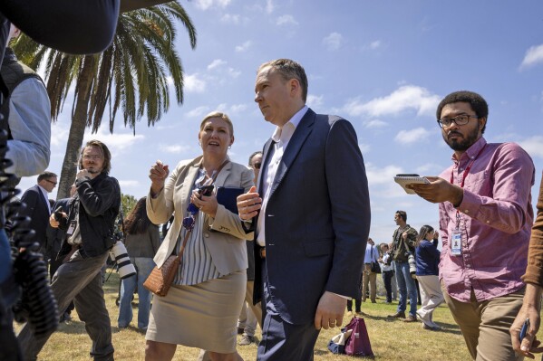 Environmental Protection Agency (EPA) Administrator Lee Zeldin, center, speaks to media while leaving a press conference Tuesday, April 22, 2025, in San Diego. (Ana Ramirez/The San Diego Union-Tribune via AP)