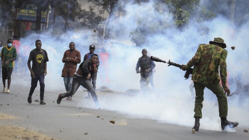 Protesters throwing rocks and police firing tear gas clash in the Mathare neighborhood of Nairobi, Kenya Wednesday, July 12, 2023. Kenyans angered by the rising cost of living were back protesting on the streets of the capital, Nairobi, on Wednesday, as they awaited a speech by a longtime opposition leader. (AP Photo)