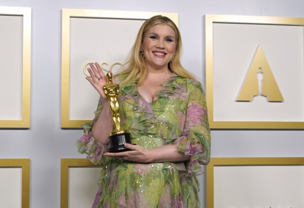 FILE - Emerald Fennell, winner of the award for best original screenplay for "Promising Young Woman," poses in the press room at the Oscars on April 25, 2021, in Los Angeles. Fennell's upcoming film "Saltburn," releases November 24. (AP Photo/Chris Pizzello, File)