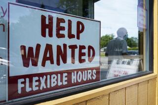 File - A help wanted sign is displayed in Deerfield, Ill., on Wednesday, Sept. 21, 2022. On Thursday, the Labor Department reports on the number of people who applied for unemployment benefits last week. (AP Photo/Nam Y. Huh, File)
