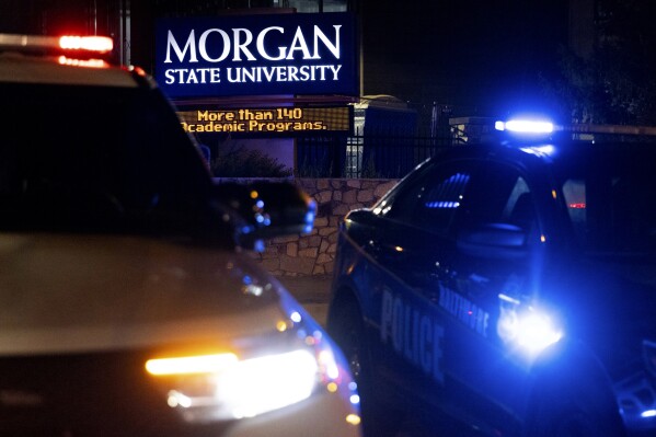 FILE - Police block off the entrance to Morgan State University as they respond to a shooting, Oct. 3, 2023, in Baltimore. A second suspect has been arrested in the shooting that left five people injured during homecoming celebrations at the historically Black college. Officials with the U.S. Marshals Service say 18-year-old Jovon Williams was arrested Friday, Nov. 17, and charged with attempted first-degree murder and other counts. (AP Photo/Julia Nikhinson, File)