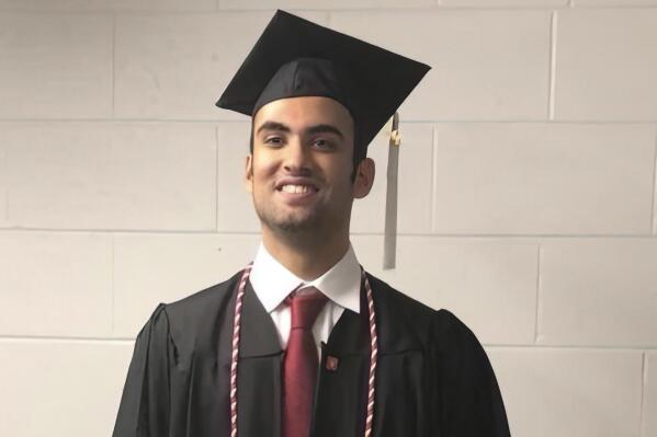 Prince Abdullah bin Faisal al Saud wears cap and gown for his undergraduate graduation from Northeastern University in Boston, in 2018. Tough prison sentences that Saudi Arabia has handed the Saudi student and a Saudi-American citizen suggest Saudi Crown Prince Mohammed bin Salman is maintaining or escalating a crackdown on Saudi dissidents in the West, Saudi exiles and rights groups say. The Saudi prince who was attending graduate school in Boston is the latest person targeted as part of what the FBI and others say is Saudi Arabia's crackdown on Saudis in the United States. (AP Photo)