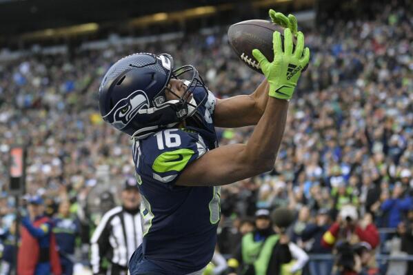 Seattle Seahawks wide receiver Tyler Lockett (16) makes a touchdown catch in the end zone against the Carolina Panthers during the first half of an NFL football game, Sunday, Dec. 11, 2022, in Seattle. (AP Photo/Caean Couto)