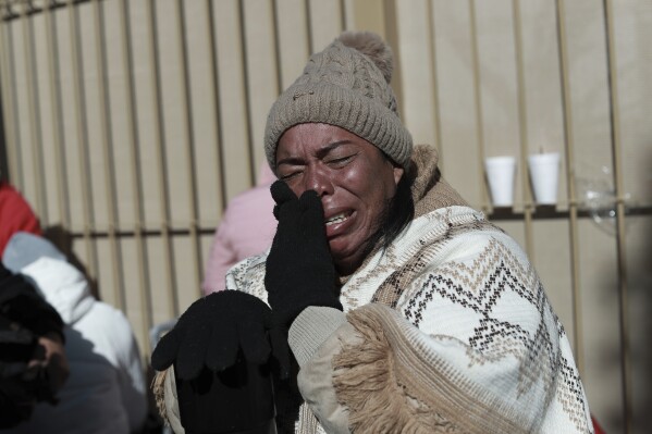 Colombian migrant Margelis Tinoco cries after her CBP One appointment was canceled at the Paso del Norte international bridge in Ciudad Juarez, Mexico, on the border with the United States on Jan. 20, 2025, on the inauguration day of U.S. President Donald Trump. (AP Photo/Christian Chavez)