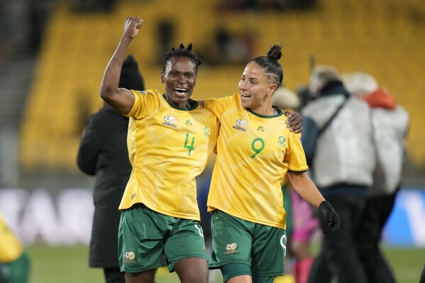 South Africa's Noko Matlou, left, and South Africa's Gabriela Salgado celebrate after the Women's World Cup Group G soccer match between South Africa and Italy in Wellington, New Zealand, Wednesday, Aug. 2, 2023. (AP Photo/Alessandra Tarantino)