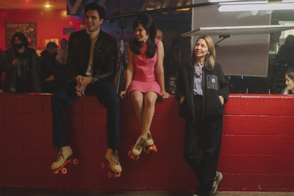 This image released by A24 shows Jacob Elordi, from left, Cailee Spaeny, and Sofia Coppola on the set of 