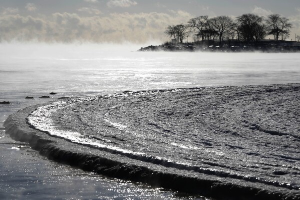 Steam rises off Lake Michigan along the shoreline in Evanston, Ill., Tuesday, Jan. 16, 2024. Millions of Americans face below-zero temperatures as storms bring blast of Arctic air, snow and ice. (AP Photo/Nam Y. Huh)