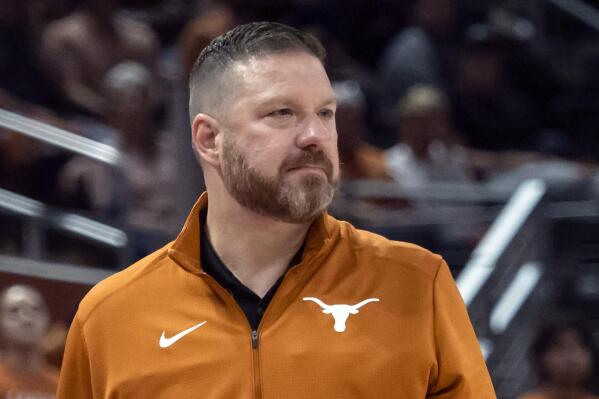 FILE - Texas head coach Chris Beard looks on during the first half an NCAA college basketball game against UTEP on Nov. 7, 2022, in Austin, Texas. Mississippi has hired Chris Beard as basketball coach five weeks after his firing from Texas following a domestic violence arrest. The Rebels announced Beard's hiring on Monday, March 13, 2023, and will introduce him Tuesday in a public event at the SBJ Pavilion. (AP Photo/Michael Thomas, File)