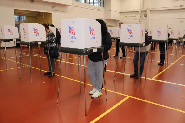 FILE - Maryland voters cast their ballots on Nov. 3, 2020 at the Pip Moyer Recreation Center in Annapolis, Md. The Maryland Senate has voted for a constitutional amendment that would enable Maryland voters to decide whether people who are appointed to vacancies in the state legislature keep their seats through a special election in the first two years of a term. The Senate voted 43-2 pm Tuesday, Feb. 27, 2024 for the measure, which now goes to the House. (AP Photo/Brian Witte, file)