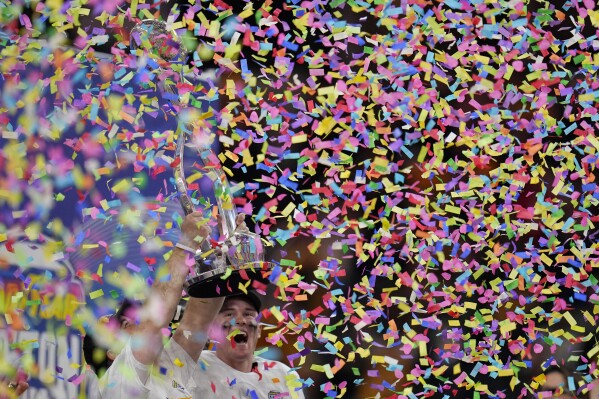 Missouri coach Eliah Drinkwitz, bottom left, and quarterback Brady Cook celebrate the team's win over Ohio State in the Cotton Bowl NCAA college football game Friday, Dec. 29, 2023, in Arlington, Texas. (AP Photo/Julio Cortez)