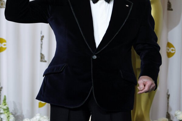 FILE - Christopher Plummer poses with the Oscar for best supporting actor for his work in "Beginners" during the 84th Academy Awards on Feb. 26, 2012, in the Hollywood section of Los Angeles. Plummer, the dashing award-winning actor who played Captain von Trapp in the film "The Sound of Music" and at 82 became the oldest Academy Award winner in history, has died. He was 91. Plummer died Friday morning, Feb. 5, 2021, at his home in Connecticut with his wife, Elaine Taylor, by his side, said Lou Pitt, his longtime friend and manager. (AP Photo/Joel Ryan, File)