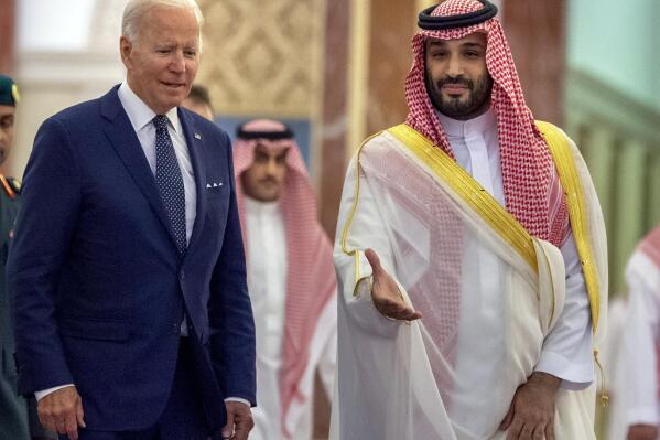FILE - In this photo released by the Saudi Royal Palace, Saudi Crown Prince Mohammed bin Salman, right, welcomes U.S. President Joe Biden to Al-Salam Palace in Jeddah, Saudi Arabia, July 15, 2022. A federal judge dismissed a U.S. lawsuit against Saudi Crown Prince Mohammed bin Salman in the Saudi killing of U.S.-based journalist Jamal Khashoggi on Tuesday, Dec. 6, 2022, bowing to the Biden administration's insistence that the prince was legally immune in the case.(Bandar Aljaloud/Saudi Royal Palace via AP, File)