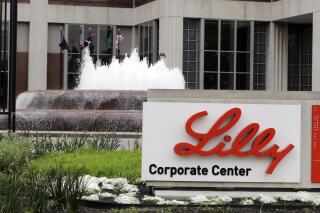 FILE- In this April 26, 2017, file photo shows the Eli Lilly and Co. corporate headquarters in Indianapolis. Shares of Eli Lilly and Co. jumped early Thursday, June 24, 2021,  after the drugmaker said it will seek approval for its potential Alzheimer’s treatment later this year.   (AP Photo/Darron Cummings, File)