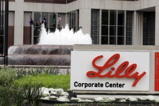 FILE- In this April 26, 2017, file photo shows the Eli Lilly and Co. corporate headquarters in Indianapolis. Shares of Eli Lilly and Co. jumped early Thursday, June 24, 2021, after the drugmaker said it will seek approval for its potential Alzheimer’s treatment later this year. (AP Photo/Darron Cummings, File)