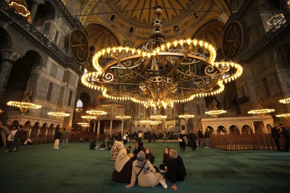 People visit Byzantine-era Hagia Sophia mosque in Istanbul, Turkey, Sunday, April 13, 2025. (AP Photo/Emrah Gurel)