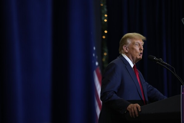 Former President Donald Trump speaks during a commit to caucus rally, Tuesday, Dec. 19, 2023, in Waterloo, Iowa. (AP Photo/Charlie Neibergall)